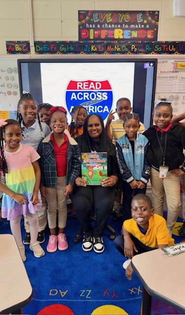 Dr. Latonya M. Peterson reading with students during Read Across America